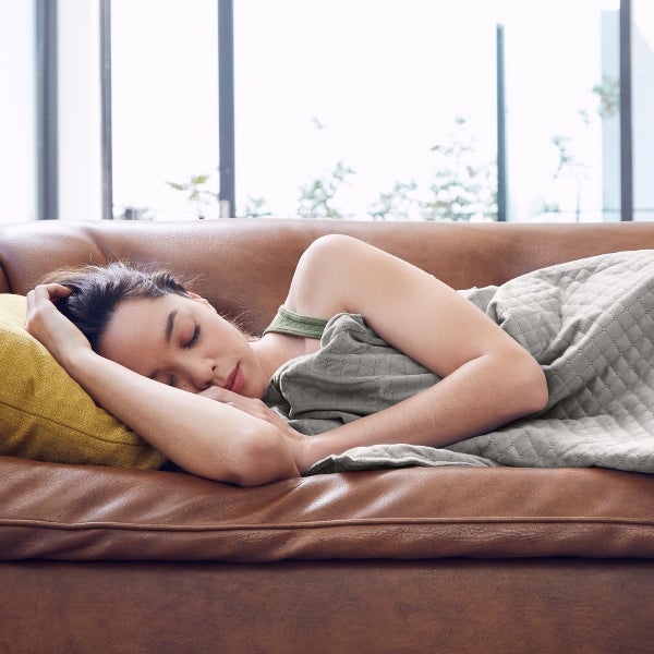 DreamCloud Weighted Blanket Woman Enjoying Weighted Blanket